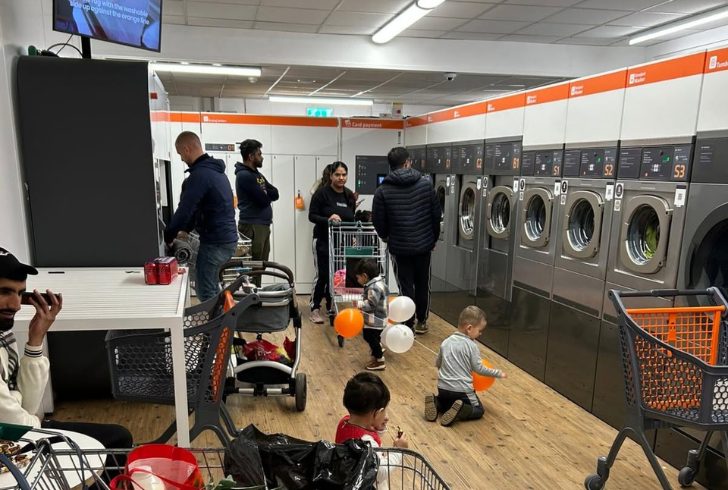 Busy Laundromat With Washing Machines